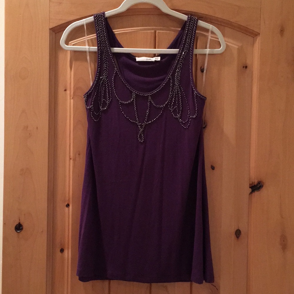Long, purple tank a bejeweled chest!